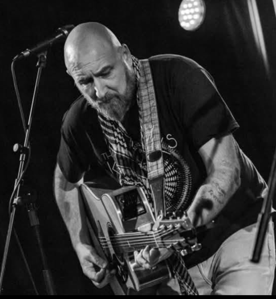 Johnny Anderson performing live with acoustic guitar